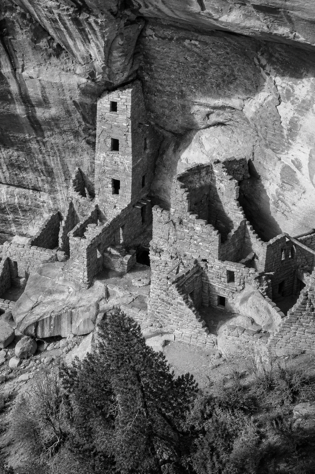 Mesa Verde cliff dwellings or a historic black-and-white photo of a Colorado mining camp